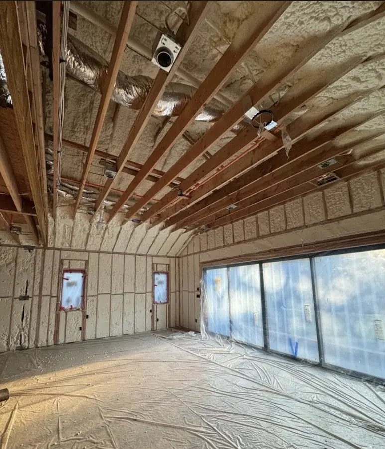 Interior walls and ceiling insulated with spray foam during new construction in Lima